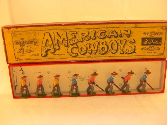 Britains #183 Cowboys on Foot: Britains #183 Cowboys on foot; condition pristine; 8 pieces; post war figures loose in good pre war box.