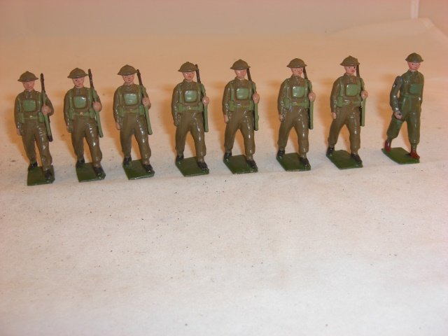 Britains #1858 Infantry in Battledress: Britains #1858 Infantry in Battledress; mismatched officer, baton missing; condition excellent; 8 pieces; post war.