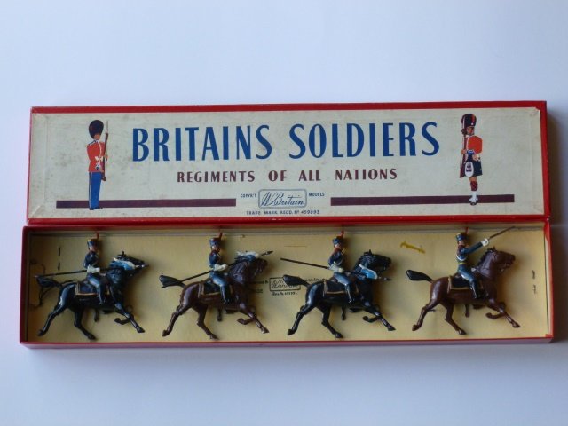 Britains Set #217 Argentine Army Grenadiers: Argentine Army Horse Grenadiers. Post War. 4 mounted Grenadiers in full dress. Tied in tie card in original R.O.A.N. box. Condition excellent. Box very good.