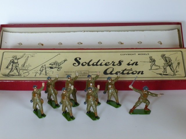 Britains Set #1612 British Infantry in Action: Bomb throwing with gas masks. Pre-War.8 pieces. Untied. Retaining card inside original box. Condition excellent. Box very good.