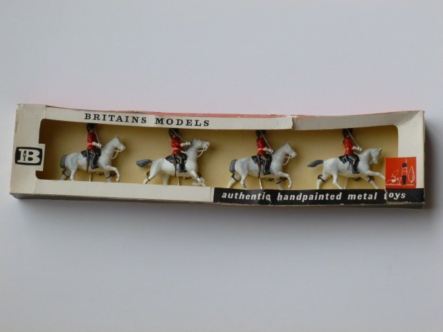 Britains Set #9210 Royal Scots Greys, Mounted: Britains Models, 4 Scots Greys mounted. Post War. Tied in original box (no cellophane). Condition excellent. Box fair. (four small splits on top of box).