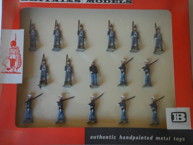 Britains Set#9381 USA Marines & West Point Cadets: 16 pieces. Pre-War. Tied to retaining card. In original box with cellophane top. Condition excellent. Box very good.