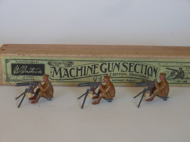 Britains Set #198 Machine Gun Section: Three pieces with original box. Pre- War. Untied. Condition very good. Box very good.