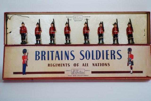 Britains Set #76 Middlesex Regiment: Post War. 8 pieces tied in original R.O.A.N. box. Condition excellent. Box very good. (but part of one rifle missing.)