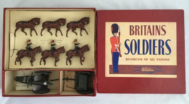 Britains Set #2077 King's Troop Horse Artillery: Post War. Originally tied in original box. 8 pieces. Condition figures excellent. Condition box excellent; with split corner.