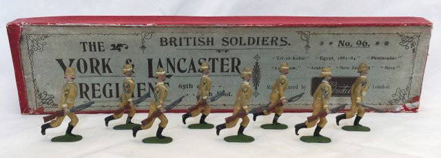 Britains Set #96 York and Lancaster Regiment: Very rare first version. 1899-1903. Active service uniform in original Printers Campaign box. 8 pieces. Condition figures very good; missing two rifle tips and one figure has dent to chest. Condition