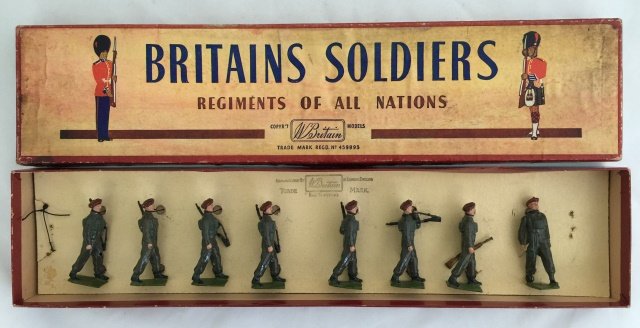Britains Set #2010 Airborne Infantry: Red Devils. Post War. Tied in an original R. O. A. N. box. 8 pieces. Condition figures very good; one figure has hole in knee. Condition box very good.