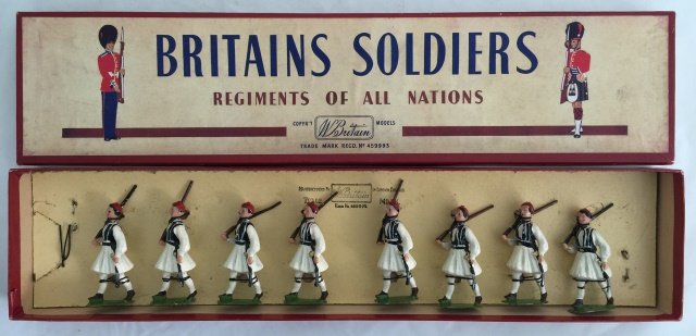 Britains Set #196 Greek Evzones: Post War. Tied in original R. O. A. N. box. 8 pieces. Condition figures excellent. Condition box excellent.
