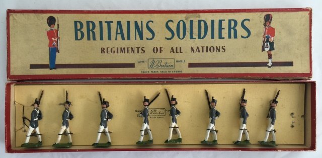 Britains Set #299 West Point Cadets Summer Dress: Post War. Tied in original R. O. A. N. box. 8 pieces. Condition figures very good; missing one plume. Condition box very good; with edge splits.