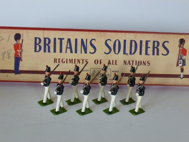 Britains Set #221 Uruguayan Cadets: Post War. 8 pieces in original R.O.A.N. box, untied. Condition excellent. Box very good. (a bit of pencil writing on lid)