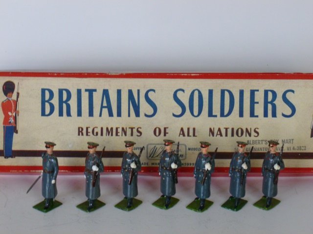 Britains Set #2027 Russians in Winter Dress: Post War. 7 pieces untied in original R.O.A.N. box. Condition excellent. Box good (but split in bottom of it)