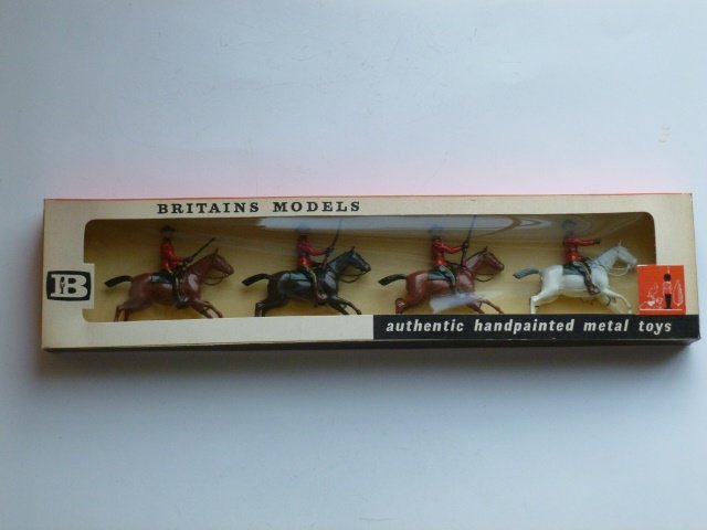 Britains Set #9256 Royal Canadian Mounted Police: on horses. Post War. 4 pieces tied in original cellophane front box. Condition excellent. Box excellent.