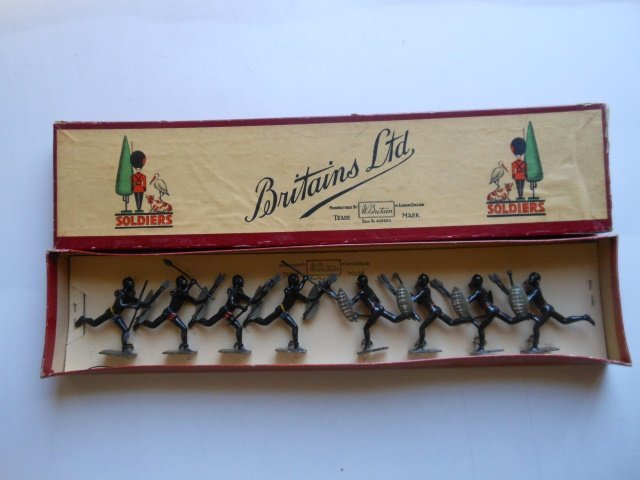 Britains Set #147 Zulus: Post War. 8 pieces tied in original comic labeled box. Condition very good box very good.