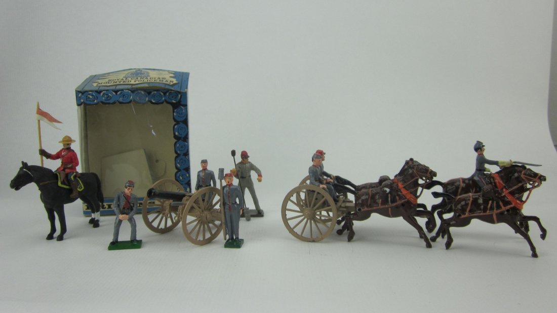 Britains Set #699 Plastic Royal Canadian Police: Eyes Right. Post War. In Cello Front box. Mounted. 12 Pieces including Gun, Caisson, 2 Riders, 4 Horses, 4 Trace and 4 Crew. Condition Very Good; 1 man ramrod loose, no box.