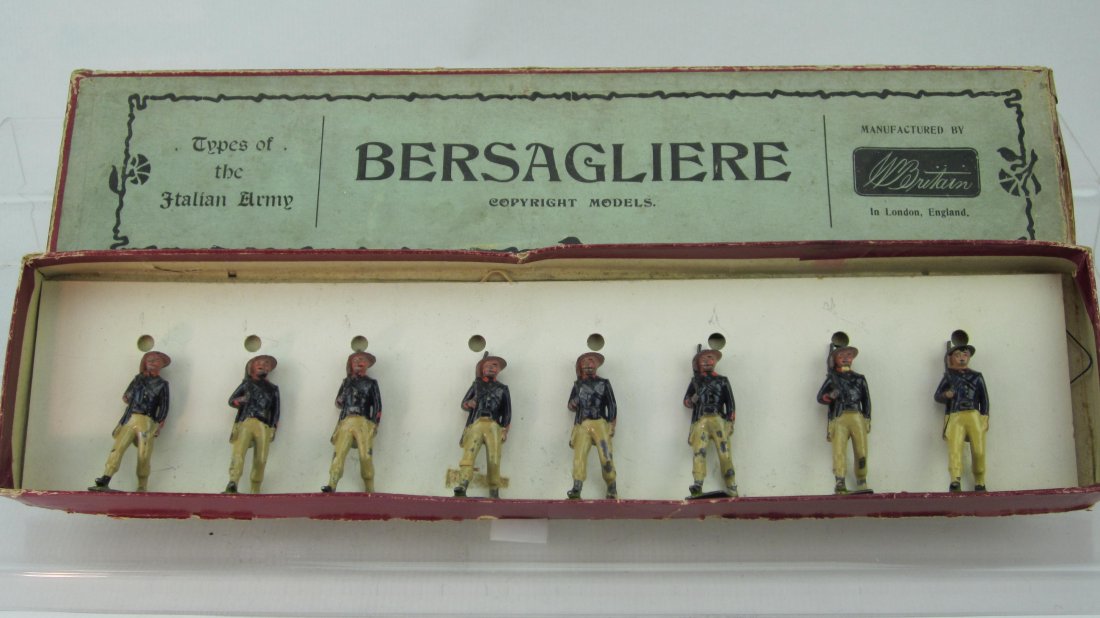 Britains Set #169 Italian Bersagliere: Pre War. In Types of the Italian Army Label box. 8 Pieces. Condition Good; 2 rifle tips gone and torn corners in flaps of lid; 1 man mismatch and no tie card.
