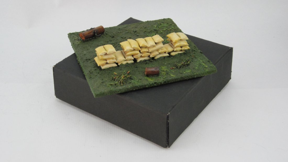 The Army Supply Company Copy of Britains Set #1745: Sandbagged Machine Gun Emplacement. Circa 1990. 6 Inch by 6 Inch base. In Original box. 1 Piece. Condition Near Mint.