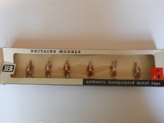 Britains set #9302 Attendants to the State Coach: 6 pieces. Post War. Tied in original cellophane fronted box. Condition excellent. Box excellent.