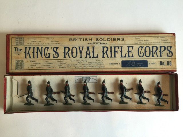 Britains Set #98 King's Royal Rifle Corps: Tied in Original Campaign Box. 1st Version Pigeon Chested. Circa 1899. 8 Pieces. Condition Figures Pristine. Condition Box Pristine.