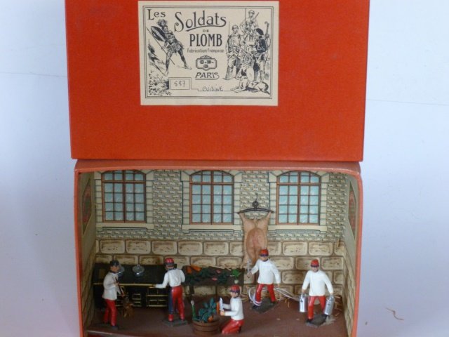 Mignot Cuisine: Kitchen. 9 pieces, most of them glued to the box. 2 figures loose. Post War. Condition of figures excellent. Box very good.