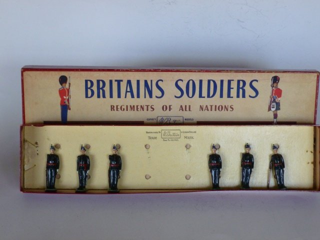 Britains from set #2090 Royal Irish Fusiliers: 6 figures. Untied; but original retaining card In R.O.A.N. box. Post War. Condition very good. Box very good.