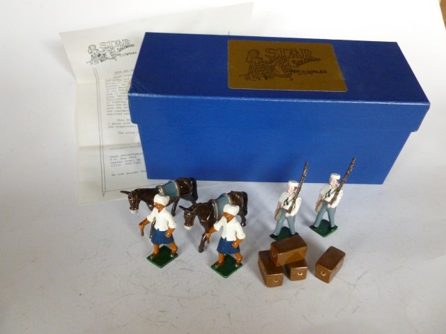 Star First Bengal Fusiliers: 10 pieces which includes 2 mules, 4 men and 4 molded boxes. Post War. In original box. Condition excellent. Box good.