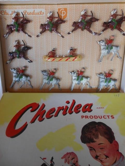 Cherilea Cowboys and Indians Display: 11 pieces. Including RARE Indian canoe. Post War. Tied in original illustrated box. Condition excellent. Box excellent.