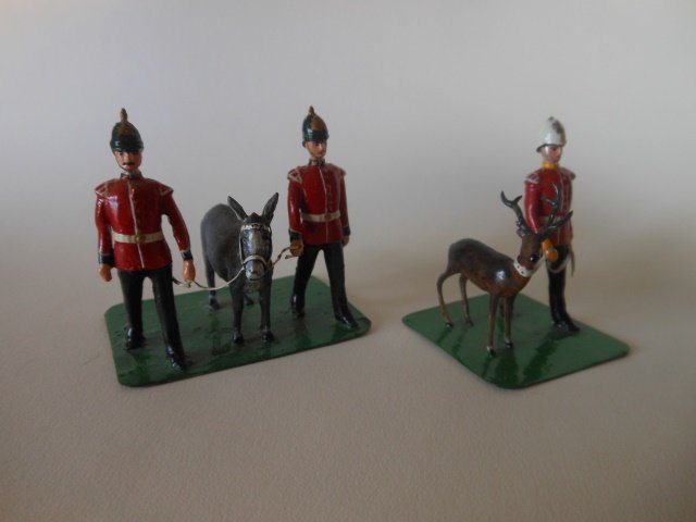 Regimental Mascots: Two men and a mule mascot of the 32nd Duke of Cornwall's Infantry, on one base; and one Mascot handler from the Royal Canadian Regiment of Infantry with an Antelope on the other base. Post War. Unboxe
