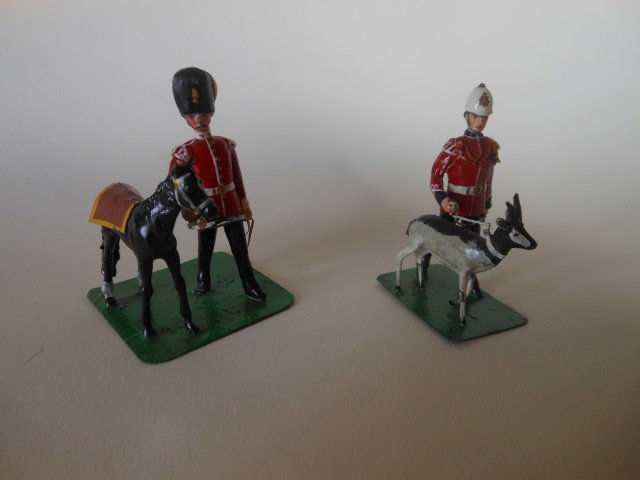 Regimental Mascots: Fusilier Handler with Pony Mascot on one base; and a Royal Northumberland Fusilier Hander with Black Buck Mascot. Post War. Unboxed. Condition excellent.