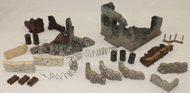 Build-A-Rama Scenic Effects Lot: Lot Includes Build-A-Rama Bombed Building, Corner Wall, Smaller Walls, Rubble, Sandbags, Barbed Wire, Barrels, Crates, Debris. Condition Excellent. No Box. 20 Pieces