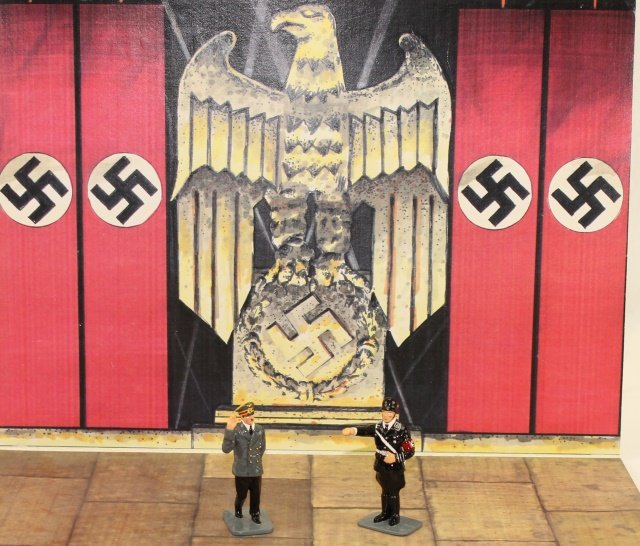 King and Country WWII LAH05 LAH07A Hitler: Set #LAH05 Hitler Saluting - Gloss Paint; Set #LAH07A SS Man Saluting Gloss Paint; Prop-up Cardboard Backdrop for Display. Condition Excellent. No Boxes. 3 Pieces