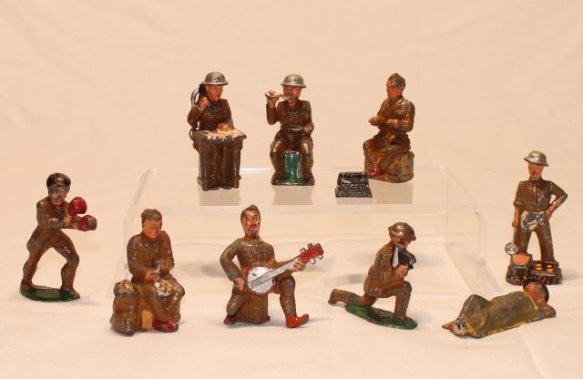 Dimestores in Bivouac, Barclay and Manoil: 9 pieces including soldiers typing, boxing, eating, cook's helper and more, condition fair to good