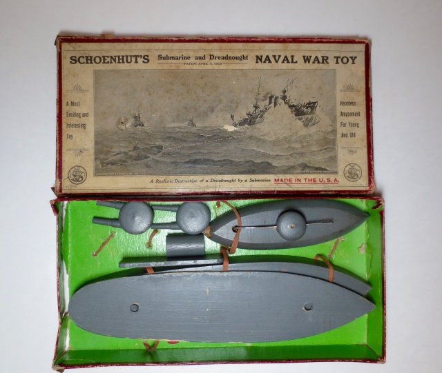 Schoenhut's Submarine and Dreadnought: Naval War Toy. 8 pieces. In original illustrated box. Condition good. Box very poor (box corners on 2 sides torn on bottom and all 4 on top are torn. Excess damage to box).