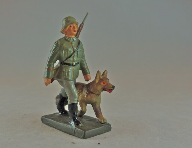 Lineol German Sentry with Guard Dog: Nothing wrong with it ! No cracks and like new paint quality. Excellent face, paint quality and dog detail. Made only 1937-39. Condition pristine.