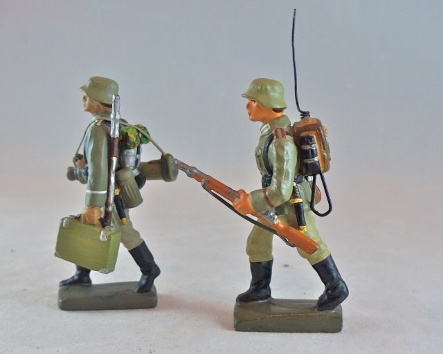 Krock 2 German Soldiers w/Radio & Gun Barrels: Made postwar. No cracks or wear. Like new paint quality. Great detail to the radio and case with extra barrels. About 10-15 years old. Condition pristine.