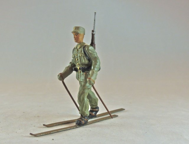 Lineol German Army Skier Rifle on Back: Thin partial neck crack with some areas of touch-up to leg and arm. These areas look normal to the eye. Excellent face and skis/pack detail. Made 1934-39. Condition Very Good.