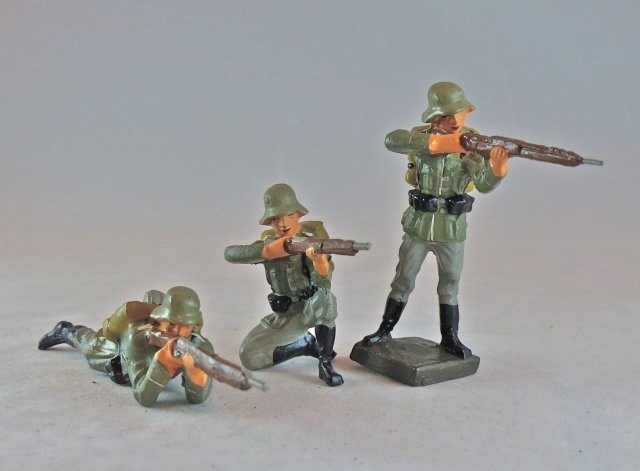 Lineol 3 Pristine German Soldiers with Rifles: Bought as old store stock at show in Germany. Other than a very thin partial crack under one rifle barrel, there is no wear or apparent aging to any of the figures. 3 Pieces. Made 1934-39. Condition P