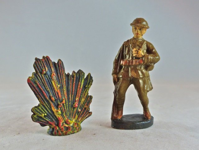 Scarce Elastolin US Fall Shot+Lineol Explosion: US soldier has the head of a nail just peeking out top of helmet with no cracks and hardly any paint wear. Face and paint quality are excellent. The 4.0 cm Lineol explosion has no cracks or wear. 2 Pi