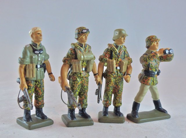 Krock 4 Waffen SS in Camo Uniforms: Like new conditions for all 4 figures. Great painting of uniforms. Neat weapon assortment. 2 MP40 's,a MP43/44 and several magazine pouches. 4 Pieces. Made about 10-15 years ago. Condition Excellent P
