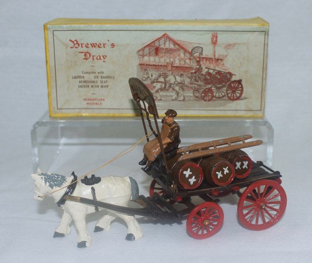 Set #810 Brewer's Dray: Brewer's Dray with Beer Barrels and Ladder Midwest British Importers. Post War. 11 pieces. Condition: figures excellent but 5 beer barrels only, Box very good to excellent.