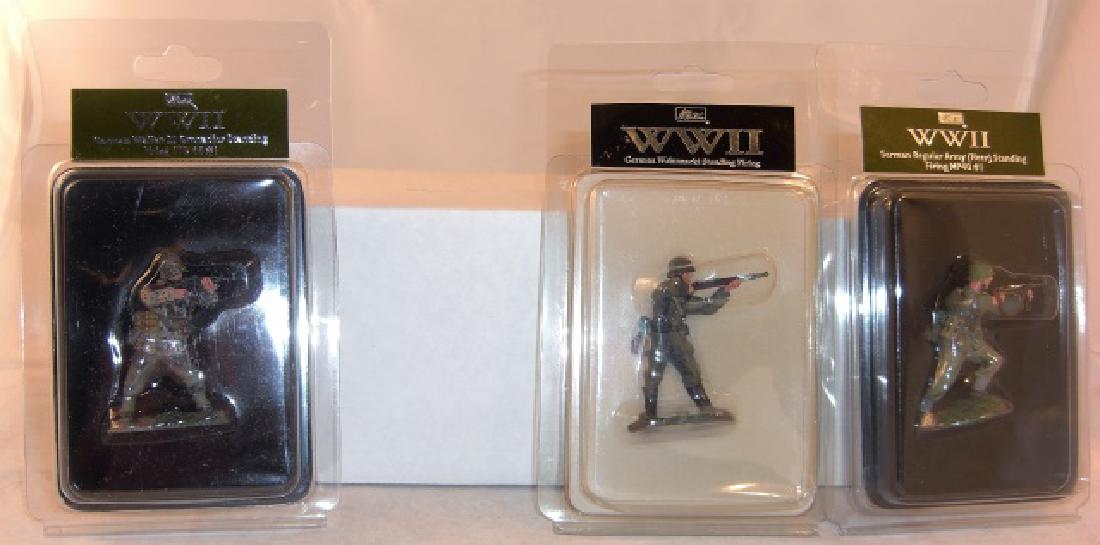 Britains WWII German Waffen SS: #25010 German Waffen SS Grenadier Standing Firing STE44#1; #25011 German Regular Army (Heer) Standing Firing MP40#1; & #17905 German Wehrnacht Standing Firing; mint in cases