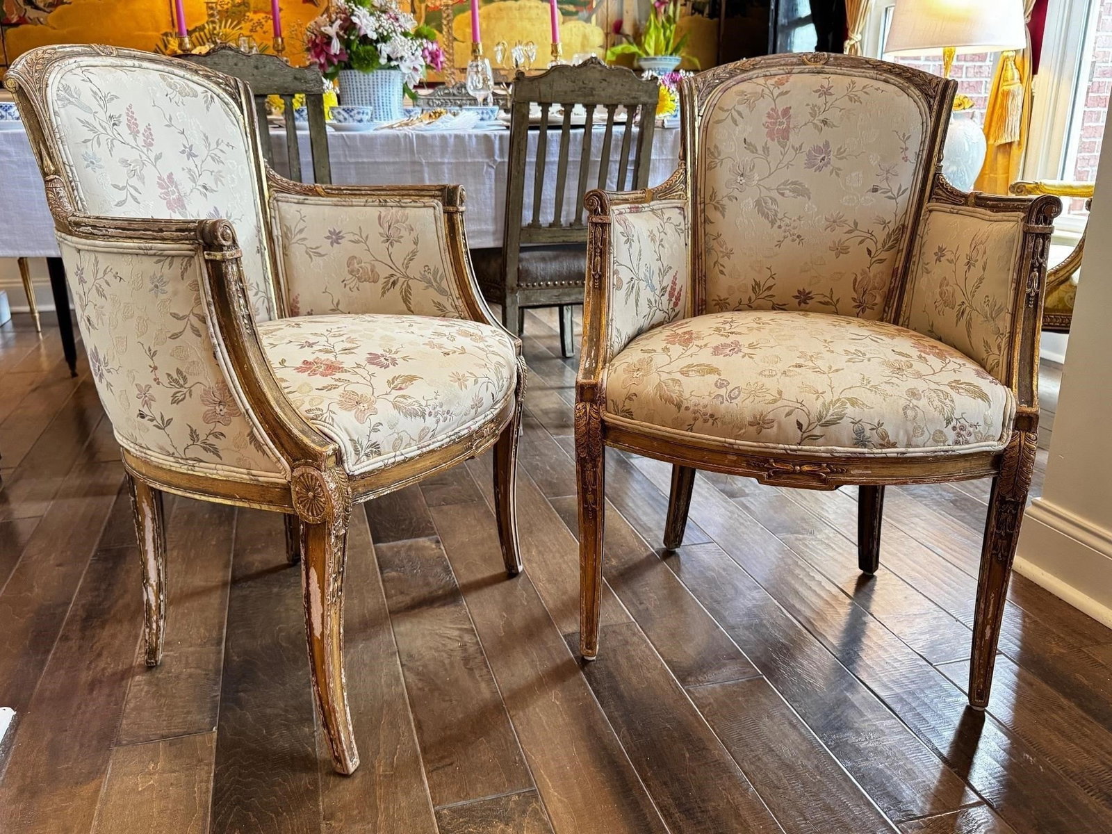 Pair Gilt Louis XV Louis XVI transitional Chairs: Late 19th / early 20th century, pair Gilt Louis XV / Louis XVI transitional Chairs 22.5"W x 21.5"H x 34.25"H Age appropriate from age and usage. Scattered surface wear. Losses to gilt. Structurally
