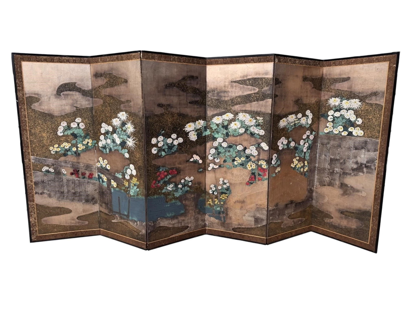 Edo Period Rimpa School Byobu Screen Chrysanthemum: 1st of a pair Late 18th to early 19th century Rinpa School Edo period six-panel screen. Beautifully decorated with flowering chrysanthemums arranged throughout a stylized garden against a softly