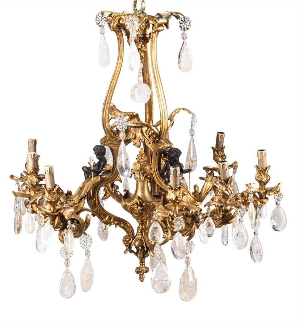 19th c. French Bronze and Rock Crystal Chandelier: This lot is located in Dallas, TX Louis XV style Bronze and Rock Crystal Chandelier. having 9 lights and bronze putti. Electrified. 34"W x 34"D x 34"H Good Condition - May have age appropriate wear co