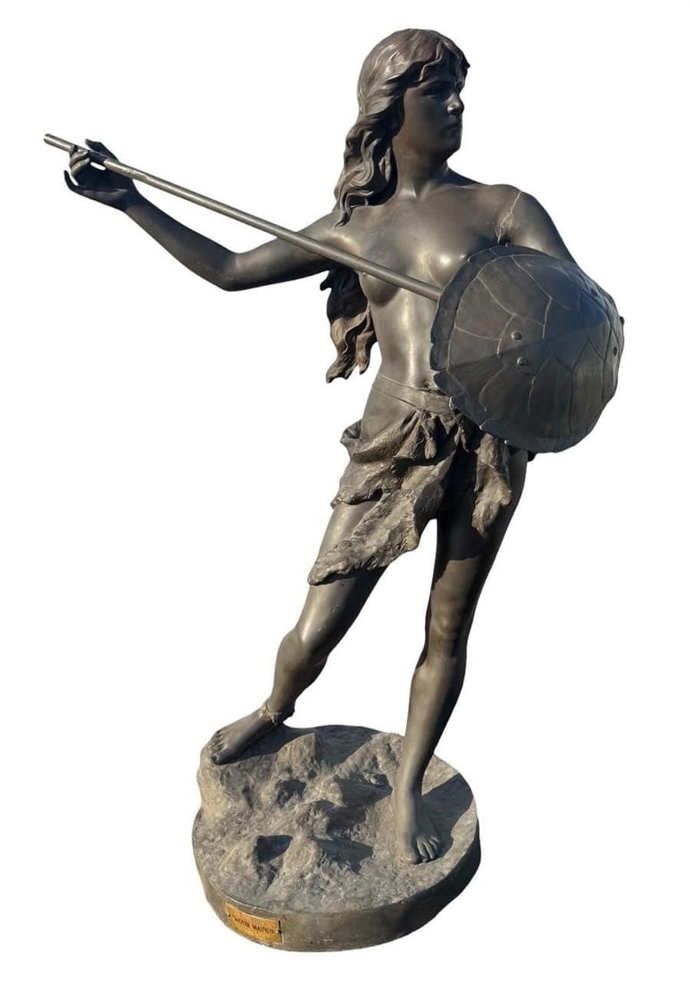 Life size bronzed metal Warrior after Jean Garnier: Bronzed cast metal sculpture after Jean Garnier's celebrated Amazone Combattante, depicting the Amazon warrior poised with shield and spear in a dynamic stance. The figure captures Garnier's character