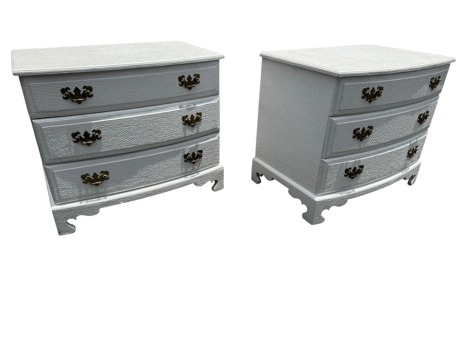 Pair grasscloth chests after Harrison Van Horn: Pair of vintage grasscloth wrapped three-drawer chests attributed to Harrison Van Horn, executed in the 1980s. Each retaining brass Chippendale style hardware over textured grasscloth surfaces and rai