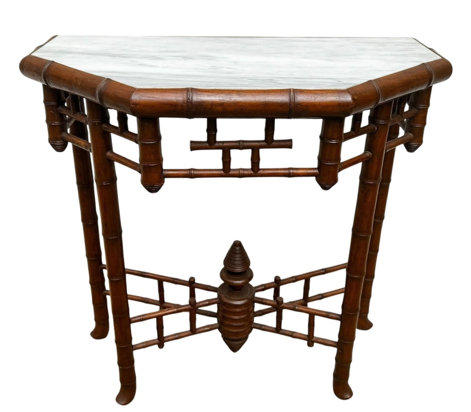 19th c. French Faux Bamboo Marble Top Console: 19th century French faux bamboo console table featuring a shaped marble top above an intricately joined faux bamboo frame with decorative stretcher and turned finial. An elegant interpretation of the