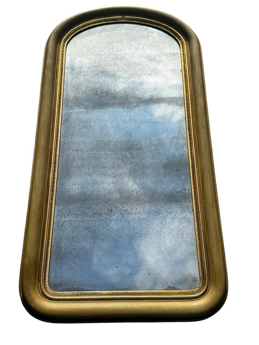Period Louis Philippe 19th c. Mirror: Elegant French Louis Philippe period mirror featuring the classic rounded crest and restrained molded giltwood frame with an inset beaded slip. Retaining its desirable antique mercury plate with chara