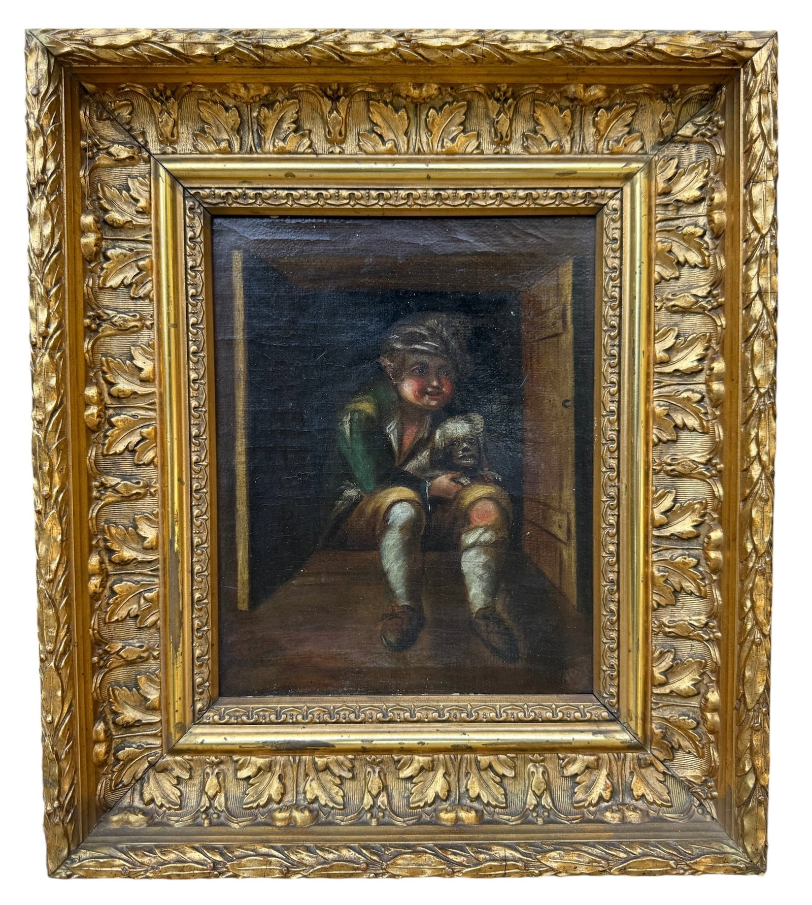18th / Early 19th Century European School Genre Painting of a Boy with Dog: 18th / Early 19th Century European School Genre Painting of a Boy with Dog18th to early 19th century European School oil on canvas depicting a seated young boy holding a small dog within a dimly lit i