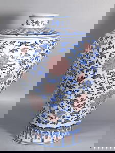 A blue and white underglaze red plum vase with lotus pattern Qianlong mark Qing Dynasty