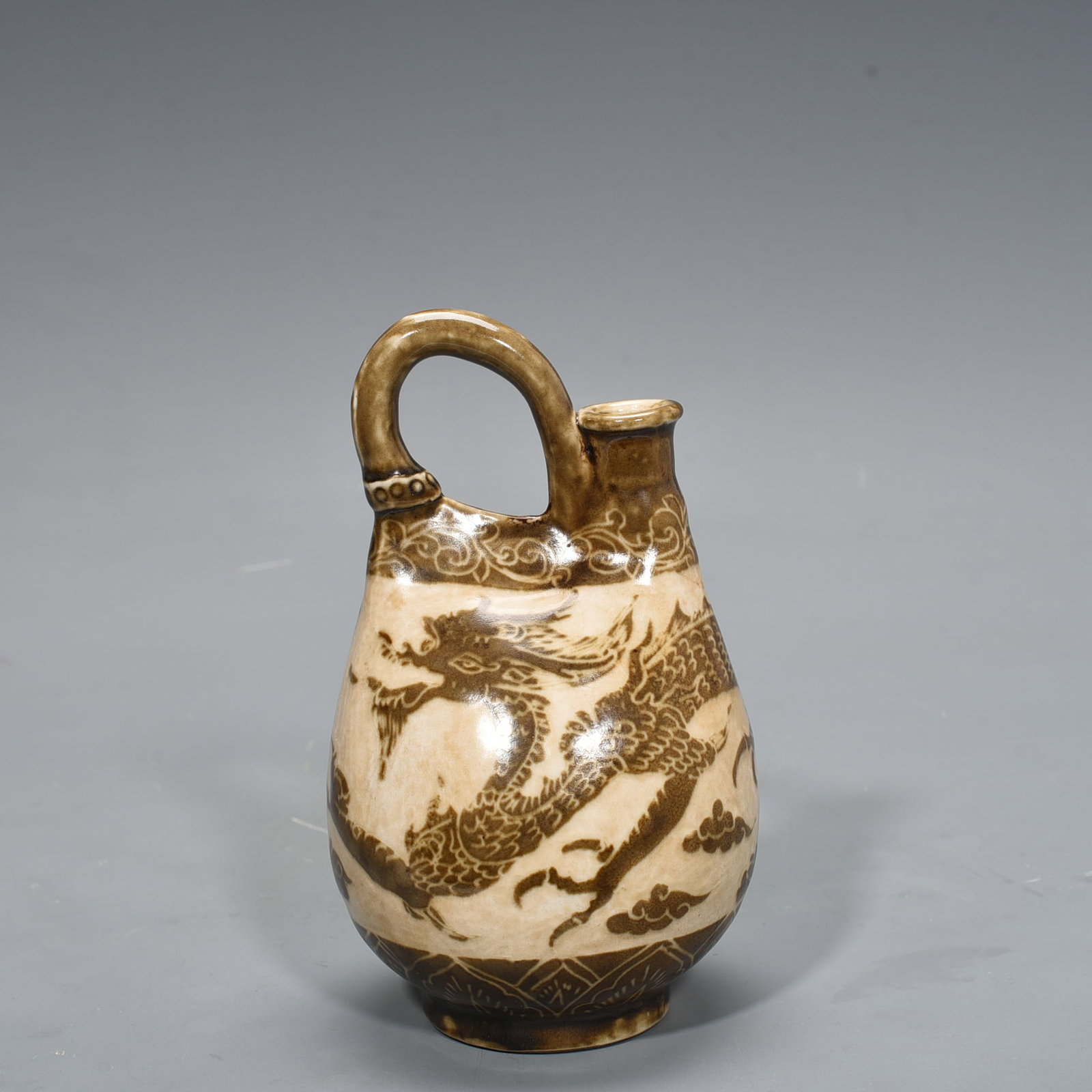 Song Dynasty Ding kiln brown color engraved dragon pattern leather pot: Size: Height 20 cm - Width 11 cm Materials: Porcelain Time Period: Song dynasty Manufactured Date: 10th-c Object: Chinese Antique ⛨ Purchase With Confidence ✔ Verified Auction House